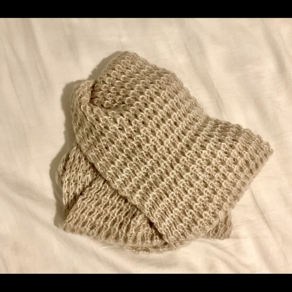 Linen colored, acrylic knit infinity scarf.